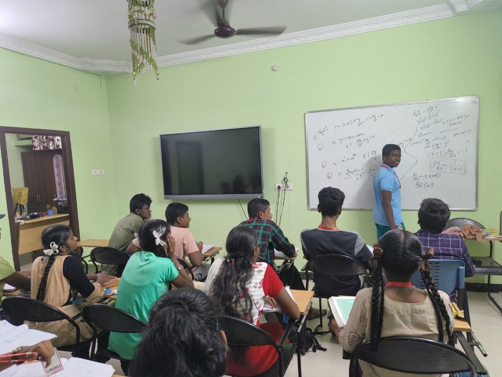 RALI classroom with smart board teaching and focused students